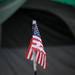 Snow dusts an American flag in front of a resident's tent at Camp Take Notice on Tuesday. Melanie Maxwell I AnnArbor.com